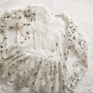 Lace peplum with embroidered detailing